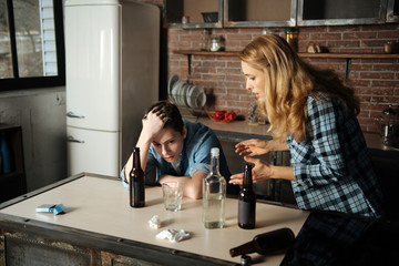 Depressed boy touching his head