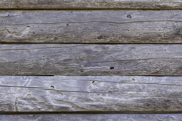 Naklejka premium Wooden wall made from logs. Background texture