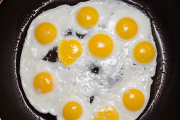 quail eggs fried in a pan