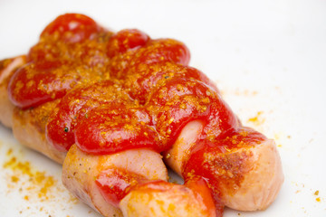 currywurst on white background