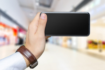 Close up of a man using mobile smart phone