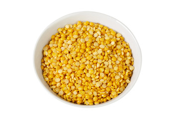 Dry yellow split peas isolated on white.
