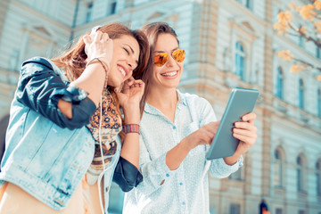 Two friends listening to music