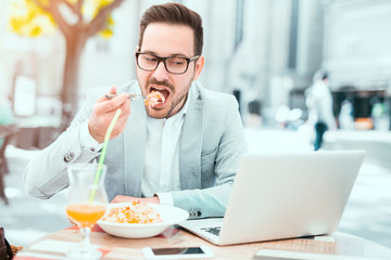 Businessman having a vegetables salad for lunch