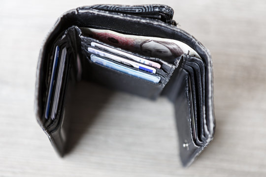 open black woman wallet with money and id cards