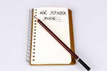 My story book on the white with brown pencil