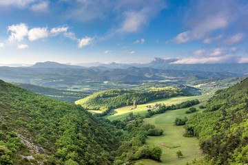 French countryside. View over the mountains (Trois Becs, Plateau des Chaux, Grand Barry et la Servelle) of the Drôme in France.