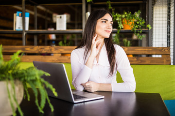 pretty businesswoman using computer in office