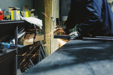 Industrial worker at the factory welding closeup