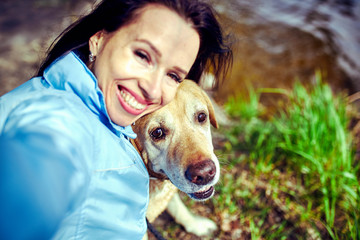 Charming girl and dog of labrador .