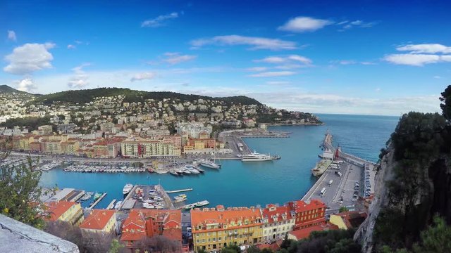 Beautiful panoramic aerial view of Port in Nice in sunny summer day. Cote d'Azure, France. City of Nice is a famous and luxury resort of French riviera (Time Lapse)
