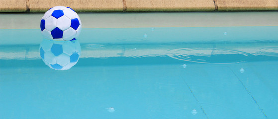 Woman in fishnet stockings with foot up on windowsill