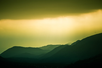 Fototapeta premium A beautiful, colorful, abstract mountain landscape with a warm green summer haze. Decorative, artistic look. Mala Fatra mountains in Slovakia.