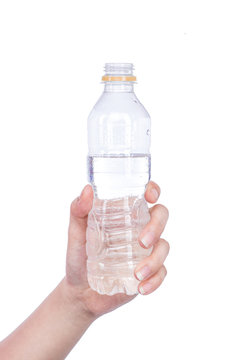 Closeup woman hand holding bottle of water