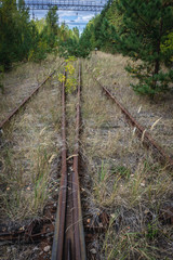 Fototapeta premium Railroad near Prypiat ghost town of Chernobyl Exclusion Zone, Ukraine