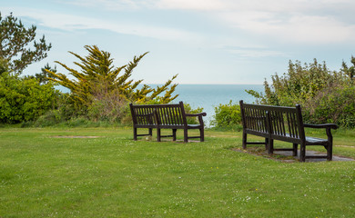 Benches with view towards the sea in Eastbourne, East Sussex, UK.