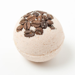 Bath bombs with coffee grains on a white