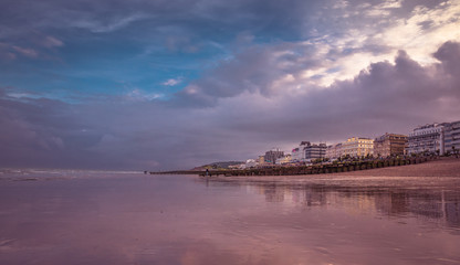 Fototapeta na wymiar Eastbourne , East Sussex, England. Eastbourne beach at the low tide on sunset