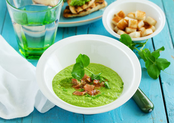 Soup of green peas with bacon and mint.