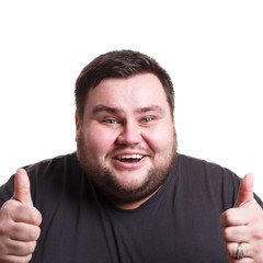 Fototapeta premium Cheerful fat man showing like, thumb-up gesture
