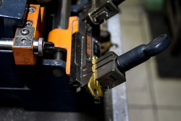 Fototapeta na wymiar Machine production of duplicate metal key.
