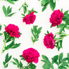 Floral pattern of peony and leaves on white background. Flat lay, top view. Pattern made of flowers