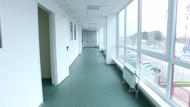 Pov of camera walking lab corridor. Steady cam shot of laboratory corridor. Point of view of walking hospital corridor