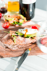 Wine, baguette and cheese on wooden background