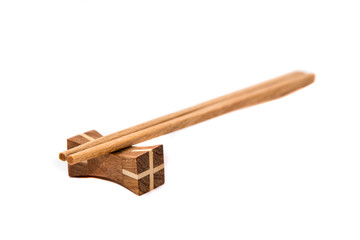 Wooden chopsticks on white backgrounds