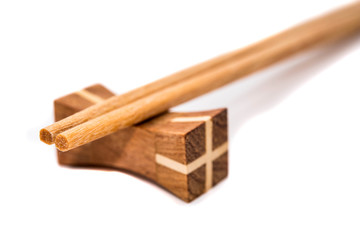 Wooden chopsticks on white backgrounds