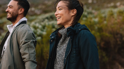 Smiling couple hiking in countryside