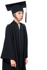 Portrait of a graduate little girl student in a black graduation gown with hat. Child making silly grimace - expressing shocked face - isolated on white background.
