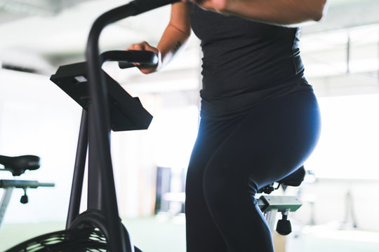 Unrecognizable woman on exerciser