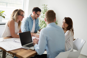 Designers working on new project in modern office