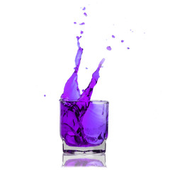 pink cocktail splashing on a glass on white background