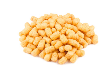 side view of corn puff snacks pile isolated on white