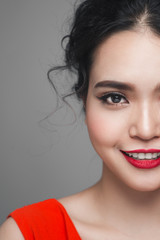 Fashion half face of asian woman with elegant hairstyle. Perfect makeup.