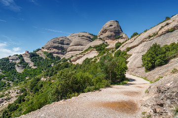 Sunny view of mountains of Santa Maria de Montserrat Abbey in Monistrol de Montserrat, Catalonia, Spain.