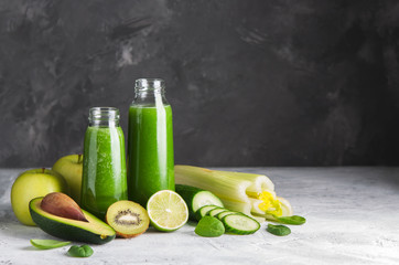 Fresh green smoothies from the green fruits and vegetables.Glass bottle.