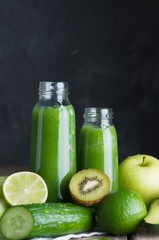 Fresh green smoothies from the green fruits and vegetables.Glass bottle.