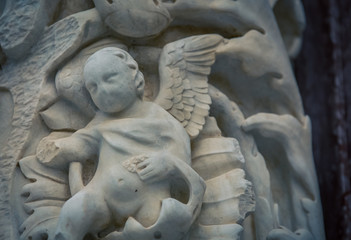 Fototapeta na wymiar worn baby statue Italy 