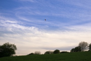 Paraglider and balloon flying in the air during colorful sunset. Slovakia