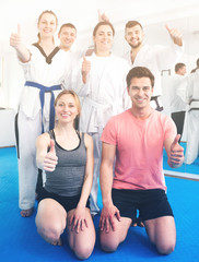 Adults happy to attend karate class
