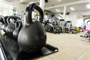 Naklejka na ściany i meble Fitness room with many type sport equipment, Gym background