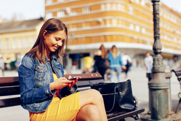 Young woman using a smartphone in the city