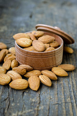 Almonds on the old wooden background