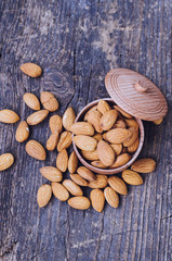 Almonds on the old wooden background