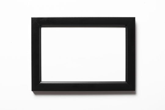 Empty copy space black photo frame isolated on white.