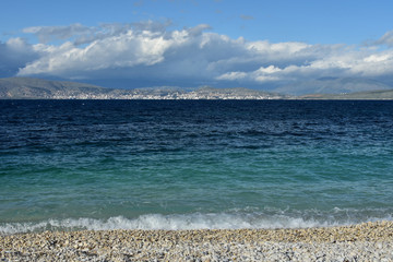 The Albanian town of Saranda seen from the beach near Kassiopi, Corfu Island, Greece 