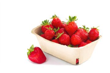 Organic fresh strawberries fruit in paper box isolate on white background